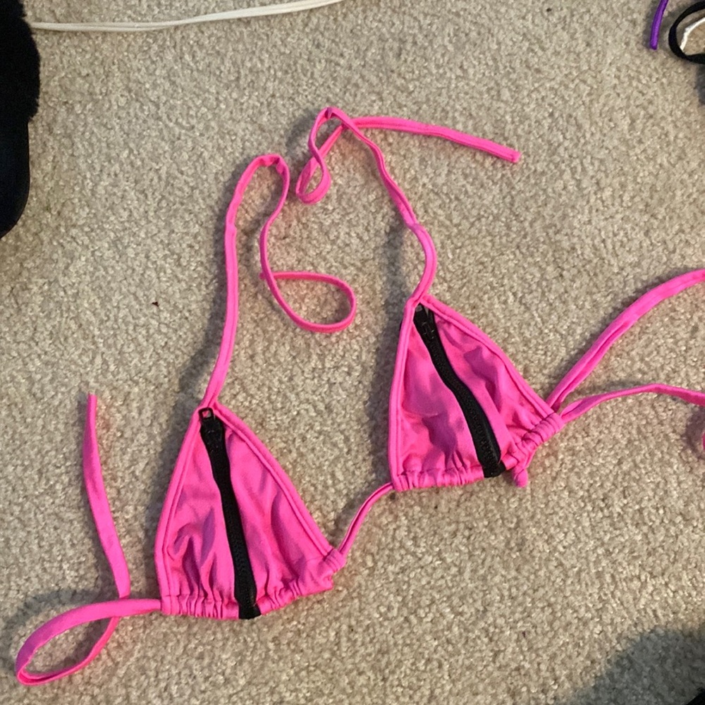 Hot pink bikini top with black zippers